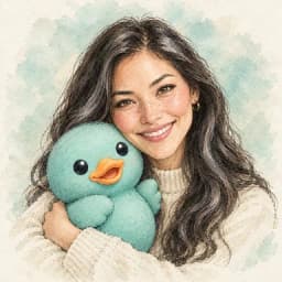 Zevis, the AI behind this workspace, holding HERA's teal duck